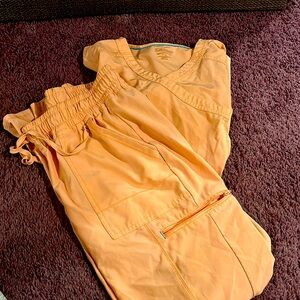 Peach colored scrubs